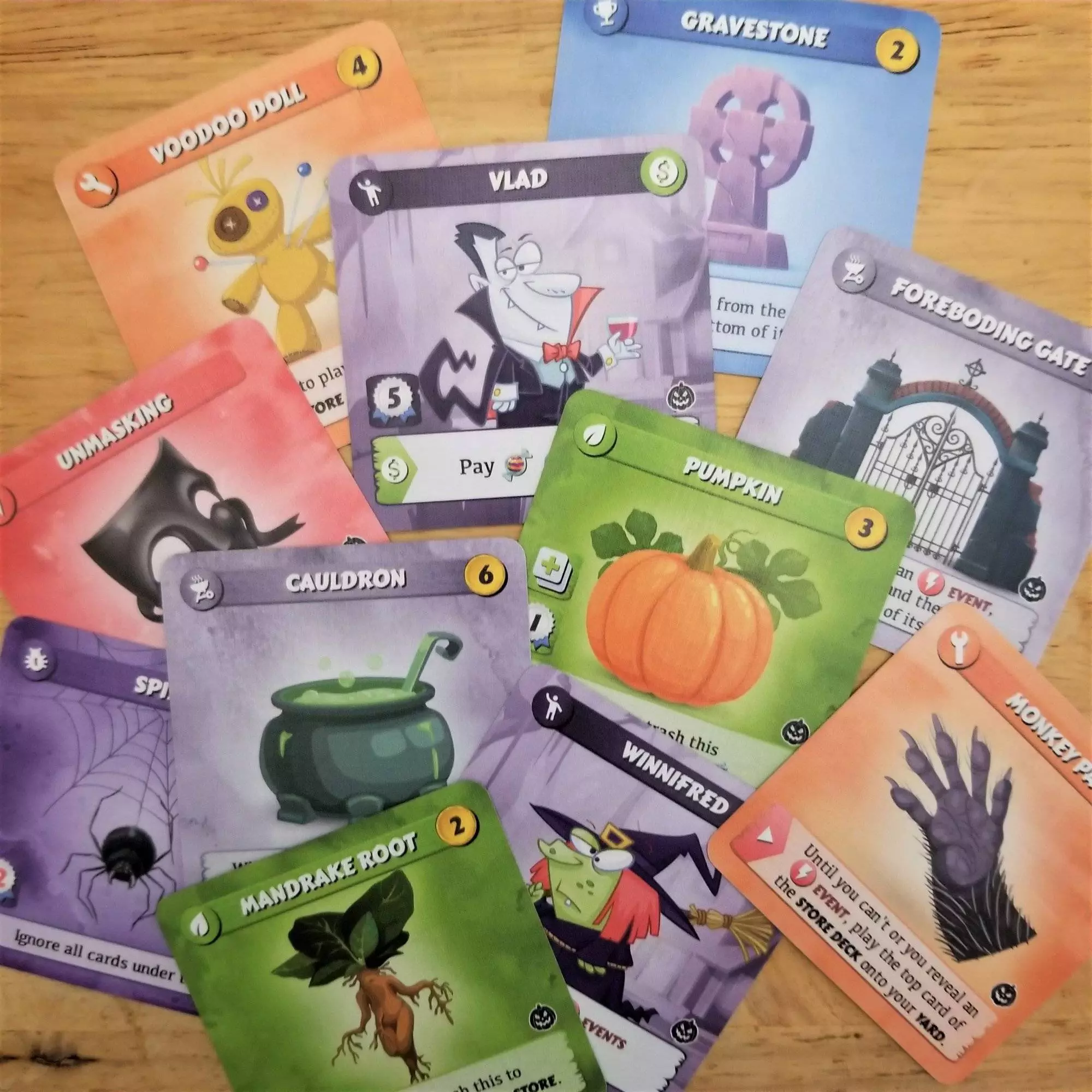 New cards from Turf War: Trick or Treat expansion laid out on the table