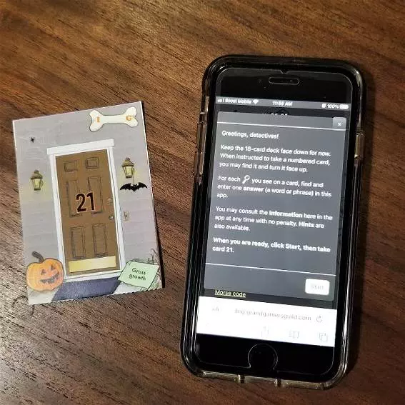 The Pumpkin Problem app next to a card from the game